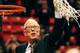 SAN DIEGO, CA - MARCH 08: Head coach Steve Fisher of the San Diego State Aztecs cuts down the net as reward for winning the MWAC and acknowledges the fans after winning the game against the New Mexico State Lobos at the Viejas Arena on March 8, 2014 in S