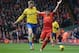 LIVERPOOL, ENGLAND - FEBRUARY 08: Per Mertesacker of Arsenal competes with Luis Suarez of Liverpool during the Barclays Premier League match between Liverpool and Arsenal at Anfield on February 8, 2014 in Liverpool, England. (Photo by Michael Regan/Gett