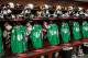 CHICAGO, IL - MARCH 16: The Chicago Blackhawks St. Patrick's Day practice jerseys hang in the locker room prior to the NHL game against the Detroit Red Wings on March 16, 2014 at the United Center in Chicago, Illinois. (Photo by Bill Smith/NHLI via Getty