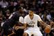 Mar 6, 2014; San Antonio, TX, USA; San Antonio Spurs forward Tim Duncan (21) is defended by Miami Heat center Greg Oden (20) during the first half at AT&T Center. Mandatory Credit: Soobum Im-USA TODAY Sports