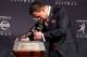 NEW YORK, NY - DECEMBER 08: Quarterback Johnny Manziel of the Texas A&M University Aggies kisses the Heisman Memorial Trophy after being named the 78th Heisman Memorial Trophy Award winner at a press conference after the 78th Heisman Trophy Presentation