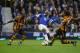 LIVERPOOL, ENGLAND - OCTOBER 19: Arouna Kone of Everton is challenged by Tom Huddlestone of Hull City during the Barclays Premier League match between Everton and Hull City at Goodison Park on October 19, 2013 in Liverpool, England. (Photo by Clive Brun