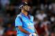 AUCKLAND, NEW ZEALAND - JANUARY 25: MS Dhoni of India reacts after he is dsimissed by Tim Southee of New Zealand during the One Day International match between New Zealand and India at Eden Park on January 25, 2014 in Auckland, New Zealand. (Photo by Ant