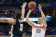 Mar 20, 2014; Buffalo, NY, USA; Syracuse Orange guard Trevor Cooney (10) shoots over Western Michigan Broncos guard David Brown (5) in the first half of a men's college basketball game during the second round of the 2014 NCAA Tournament at First Niagara C