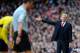LONDON, ENGLAND - FEBRUARY 22: Arsene Wenger manager of Arsenal gestures to the referee during the Barclays Premier League match between Arsenal and Sunderland at Emirates Stadium on February 22, 2014 in London, England. (Photo by Michael Regan/Getty Im