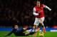 LONDON, ENGLAND - FEBRUARY 12: Tomas Rosicky (R) of Arsenal skips the tackle of Robin van Persie (L) of Manchester United during the Barclays Premier League match between Arsenal and Manchester United at the Emirates Stadium on February 12, 2014 in Londo
