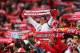 LISBON, PORTUGAL - MARCH 20: A supporter of SL Benfica looks on amongst a forest of scarves during the UEFA Europa League Round of 16 2nd leg match between SL Benfica and Tottenham Hotspur at Estadio da Luz on March 20, 2014 in Lisbon, Portugal. (Phot
