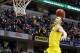 Mar 15, 2014; Indianapolis, IN, USA; Michigan Wolverines guard Nik Stauskas (11) dunks the ball after the game to celebrate defeating the Ohio State Buckeyes in the semifinals of the Big Ten college basketball tournament at Bankers Life Fieldhouse. Michig