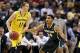 Mar 16, 2014; Indianapolis, IN, USA; Michigan Wolverines guard Nik Stauskas (11) is guarded by Michigan State Spartans guard Gary Harris (14) in the championship game for the Big Ten college basketball tournament at Bankers Life Fieldhouse. Mandatory Cred