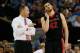ATLANTA, GA - MARCH 15: Head coach Mark Fox of the Georgia Bulldogs speaks with Nemanja Djurisic #42 during the semifinals of the SEC Men's Basketball Tournament against the Kentucky Wildcats at Georgia Dome on March 15, 2014 in Atlanta, Georgia. (Photo