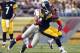 PITTSBURGH, PA - AUGUST 10: LaRod Stephens-Howling #34 of the Pittsburgh Steelers carries the ball against Spencer Paysinger #52 of the New York Giants during the game on August 10, 2013 at Heinz Field in Pittsburgh, Pennsylvania. (Photo by Justin K. Al