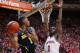BLOOMINGTON, IN - FEBRUARY 2: Glenn Robinson III #1 of the Michigan Wolverines looks to pass the ball while defended by Noah Vonleh #1 of the Indiana Hoosiers during the first half of the game at Assembly Hall on February 2, 2014 in Bloomington, Indiana.