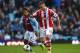 BIRMINGHAM, ENGLAND - MARCH 23: Marko Arnautovic of Stoke is pursued by Leandro Bacuna of Aston Villa during the Barclays Premier League match between Aston Villa and Stoke City at Villa Park on March 23, 2014 in Birmingham, England. (Photo by Michael R