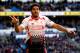 CARDIFF, WALES - MARCH 22: Luis Suarez of Liverpool celebrates after scoring hihs third and his team's sixth goal of the game during the Barclays Premier League match between Cardiff City and Liverpool at Cardiff City Stadium on March 22, 2014 in Cardiff