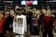 ATLANTA, GA - APRIL 08: (L-R) Russ Smith #2 (wearing white shirt), Chane Behanan #21 and Peyton Siva #3 of the Louisville Cardinals look on after they won 82-76 against the Michigan Wolverines during the 2013 NCAA Men's Final Four Championship at the Geo