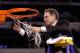 INDIANAPOLIS - MARCH 29: Head coach Tom Izzo of the Michigan State Spartans cuts down the final piece of the net following their 64-52 win against the Louisville Cardinals during the fourth round of the NCAA Division I Men's Basketball Tournament at the
