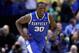 ST LOUIS, MO - MARCH 23: Julius Randle #30 of the Kentucky Wildcats celebrates after defeating the Wichita State Shockers 78 to 76 during the third round of the 2014 NCAA Men's Basketball Tournament at Scottrade Center on March 23, 2014 in St Louis, Miss