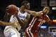 LAWRENCE, KS - FEBRUARY 24: Joel Embiid #21 of the Kansas Jayhawks grabs a rebound against Isaiah Cousins #11 of the Oklahoma Sooners in the first half at Allen Fieldhouse on February 24, 2014 in Lawrence, Kansas. (Photo by Ed Zurga/Getty Images)