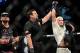 Nov 2, 2013; Long Beach, CA, USA; Mike Bronzoulls (red gloves) and Joe Riggs (blue gloves) at the end of their Bellator flight master welterweight final fight at the Long Beach Arena. Joe Riggs won by decision. Mandatory Credit: Jayne Kamin-Oncea-USA T