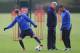 ST ALBANS, ENGLAND - NOVEMBER 25: Arsenal manager Arsene Wenger talks with player Serge Gnabry as Aaron Ramsey warms up during a training session at London Colney on November 25, 2013 in St Albans, England. (Photo by Shaun Botterill/Getty Images)