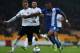 STOKE ON TRENT, ENGLAND - OCTOBER 12: Daniel Jones of Port Vale and Britt Assombalonga of Peterborough United challenge for the ball during the Sky Bet League One match between Port Vale and Peterborough United at Vale Park on October 12, 2013 in Stoke o