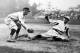 Ty Cobb sliding into third base