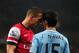 LONDON, ENGLAND - MARCH 29: Lukas Podolski of Arsenal clashes with Jesus Navas of Manchester City during the Barclays Premier League match between Arsenal and Manchester City at Emirates Stadium on March 29, 2014 in London, England. (Photo by Shaun Bott