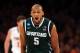 NEW YORK, NY - MARCH 28: Adreian Payne #5 of the Michigan State Spartans reacts after a basket against the Iowa State Cyclones during the regional semifinal of the 2014 NCAA Men's Basketball Tournament at Madison Square Garden on March 28, 2014 in New Yo