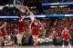 ANAHEIM, CA - MARCH 29: Aaron Gordon #11 of the Arizona Wildcats dunks the ball over Frank Kaminsky #44 of the Wisconsin Badgers in overtime during the West Regional Final of the 2014 NCAA Men's Basketball Tournament at the Honda Center on March 29, 2014