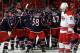 RALEIGH, NC - MARCH 29: Eric Staal #12 of the Carolina Hurricanes skates by as members of the Columbus Blue Jackets celebrate their victory over the Hurricanes following an overtime, game-winning goal scored by Ryan Johansen during their NHL game at PNC A