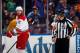 UNIONDALE, NY - JANUARY 04: Eric Staal #12 of the Carolina Hurricanes argues a first period penalty call with referee Brian Pochmara #16 in the game against the New York Islanders at the Nassau Veterans Memorial Coliseum on January 4, 2014 in Uniondale, N