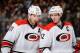 COLUMBUS, OH - MARCH 18: Jordan Staal #11 of the Carolina Hurricanes and Eric Staal #12 of the Carolina Hurricanes talk before a face off against the Columbus Blue Jackets on March 18, 2014 at Nationwide Arena in Columbus, Ohio. (Photo by Jamie Sabau/NH