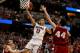 ANAHEIM, CA - MARCH 29: Nick Johnson #13 of the Arizona Wildcats goes up for a shot against Frank Kaminsky #44 of the Wisconsin Badgers in the second half during the West Regional Final of the 2014 NCAA Men's Basketball Tournament at the Honda Center on