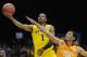 Mar 28, 2014; Indianapolis, IN, USA; Michigan Wolverines forward Glenn Robinson III (1) shoots against Tennessee Volunteers guard Derek Reese (23) in the first half in the semifinals of the midwest regional of the 2014 NCAA Mens Basketball Championship t