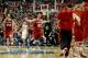 ANAHEIM, CA - MARCH 29: Josh Gasser #21 and Frank Kaminsky #44 of the Wisconsin Badgers celebrate after defeating the Arizona Wildcats 64-63 in overtime during the West Regional Final of the 2014 NCAA Men's Basketball Tournament at the Honda Center on Ma