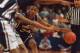 14 FEB 1995: UNIVERSITY OF CONNECTICUT HUSKIES GUARD RAY ALLEN #34 LOOKS FOR A PASSING LANE TO TEAMMATE BRAIN FAIR IN THE FIRST HALF OF THEIR GAME VERSUS THE GEORGETOWN HOYAS AT THE US AIR ARENA IN LANDOVER, MARYLAND. Mandatory Credit: Doug Pensinger/AL