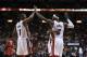Mar 31, 2014; Miami, FL, USA; Miami Heat center Chris Bosh (1) and Miami Heat forward LeBron James (6) react in the second half of a game against the Toronto Raptors at American Airlines Arena. The Heat won 93-83. Mandatory Credit: Robert Mayer-USA TODAY