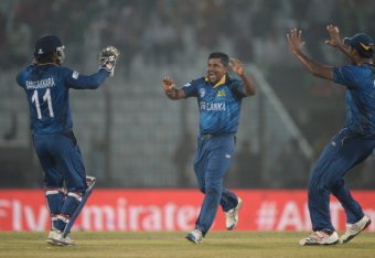 CHITTAGONG, BANGLADESH - MARCH 31:  Rangana Herath of Sri Lanka celebrates with teammates after dismissing Trent Boult of New Zealand during the ICC World Twenty20 Bangladesh 2014 Group 1 match between Sri Lanka and New Zealand at Zahur Ahmed Chowdhury St