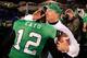 ANNAPOLIS, MD - DECEMBER 27: Quarterback Rakeem Cato #12 of the Marshall Thundering Herd hugs head coach Doc Holliday after the Herd defeated the Maryland Terrapins 31-20 to win the 2013 Military Bowl at Navy Marine Corps Memorial Stadium on December 27,