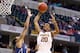 INDIANAPOLIS, IN - MARCH 13: Austin Hollins #20 of the Minnesota Golden Gophers shoots the ball in the game against the Penn State Nittany Lions during the first round of the Big Ten Basketball Tournament at Bankers Life Fieldhouse on March 13, 2014 in