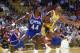 LOS ANGELES - JANUARY 1: Michael Cage #44 of the Los Angeles Clippers and Magic Johnson #32 of the Los Angeles Lakers attempt to rebound the ball, during the NBA game at the Great Western Forum, in Los Angeles, California on January 1, 1986. NOTE TO USE