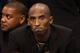 PHOENIX, AZ - JANUARY 15: Kobe Bryant #24 of the Los Angeles Lakers watches from the bench during the NBA game against the Phoenix Suns at US Airways Center on January 15, 2014 in Phoenix, Arizona. NOTE TO USER: User expressly acknowledges and agrees th