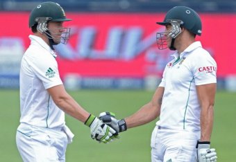 JOHANNESBURG, SOUTH AFRICA - DECEMBER 22:  Faf du Plessis (R) of South Africa celebrates his 50 with AB de Villiers during day 5 of the 1st Test match between South Africa and India at Bidvest Wanderers Stadium on December 22, 2013 in Johannesburg, South 