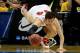 ANAHEIM, CA - MARCH 27: Frank Kaminsky #44 of the Wisconsin Badgers goes after a loose ball in the second half while taking on the Baylor Bears during the regional semifinal of the 2014 NCAA Men's Basketball Tournament at the Honda Center on March 27, 20