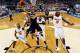 ARLINGTON, TX - APRIL 05: Shabazz Napier #13 of the Connecticut Huskies goes up for a shot as Dorian Finney-Smith #10 of the Florida Gators defends during the NCAA Men's Final Four Semifinal at AT&T Stadium on April 5, 2014 in Arlington, Texas. (Photo by