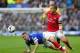 LIVERPOOL, ENGLAND - APRIL 06: James McCarthy of Everton competes with Lukas Podolski of Arsenal during the Barclays Premier League match between Everton and Arsenal at Goodison Park on April 6, 2014 in Liverpool, England. (Photo by Alex Livesey/Getty