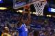 INDIANAPOLIS, IN - MARCH 30: Alex Poythress #22 of the Kentucky Wildcats dunks the ball over Caris LeVert #23 of the Michigan Wolverines in the first half during the midwest regional final of the 2014 NCAA Men's Basketball Tournament at Lucas Oil Stadium