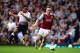 LONDON, ENGLAND - APRIL 06: Mark Noble of West Ham holds off the challenge from Raheem Sterling of Liverpool during the Barclays Premier League match between West Ham United and Liverpool at Boleyn Ground on April 6, 2014 in London, England. (Photo by J