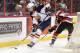 OTTAWA, ON - MARCH 13: Aaron Ekblad #5 of the Barrie Colts skates with the puck past Travis Konecny #17 of the Ottawa 67's during an OHL game at Canadian Tire Centre on March 13, 2014 in Ottawa, Ontario, Canada. (Photo by Jana Chytilova/Freestyle Photog