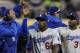 Apr 1, 2014; San Diego, CA, USA; Los Angeles Dodgers right fielder Yasiel Puig (66) high fives teammates after the game against the San Diego Padres at Petco Park. The Dodgers defeated the Padres 3-2. Mandatory Credit: Andrew Fielding-USA TODAY Sports